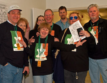 Peggy welcomes volunteers at the checkin area